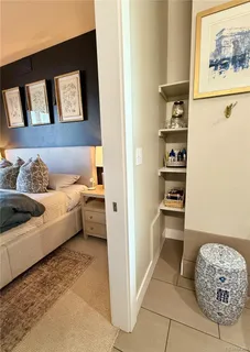 a living room with a couch and a painting on the wall