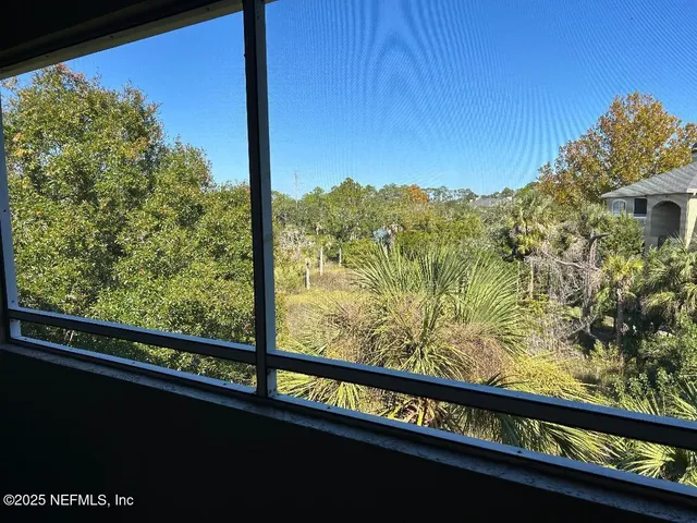 a view of a street from a balcony