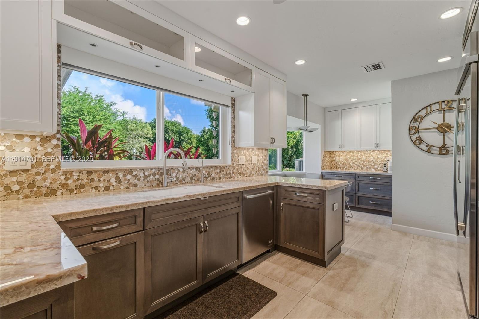 8001 Southwest 66th Terrace Miami, FL 33143 - Photo 11 of 35 a kitchen with stainless steel appliances granite countertop a sink and cabinets