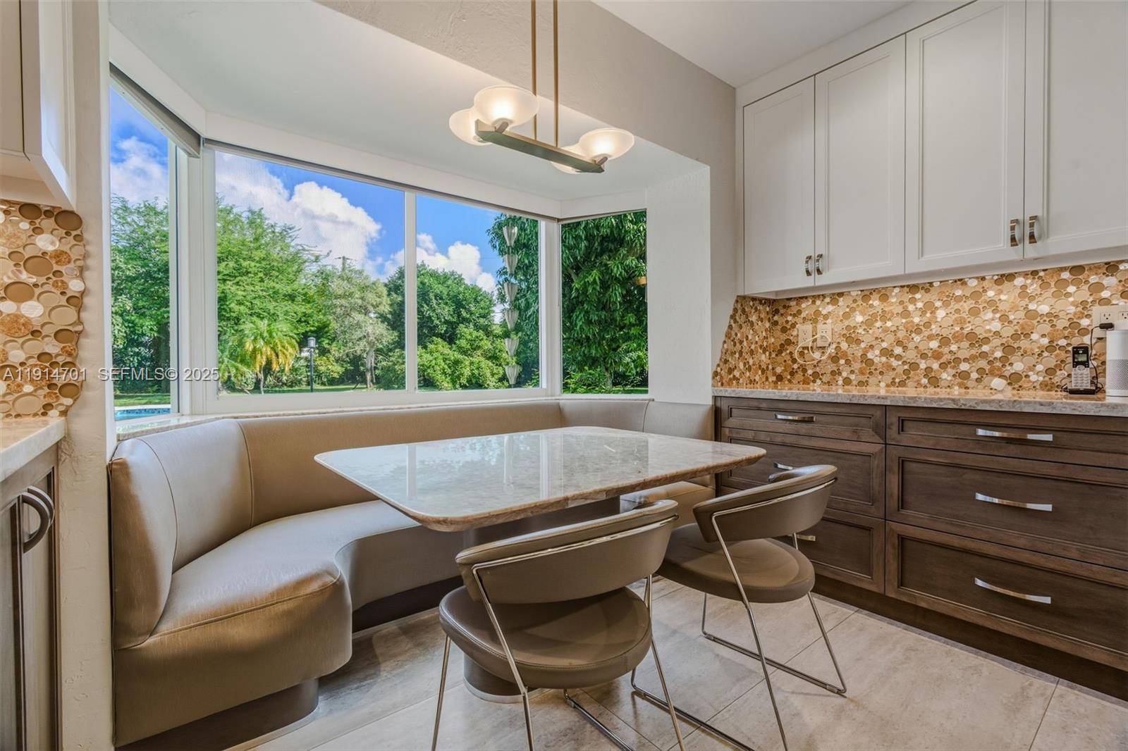 8001 Southwest 66th Terrace Miami, FL 33143 - Photo 13 of 35 a view of a dining room with furniture window and outside view