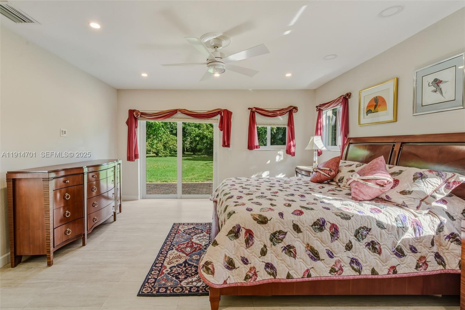 8001 Southwest 66th Terrace Miami, FL 33143 - Photo 18 of 35 a bedroom with a bed and dresser with mirror