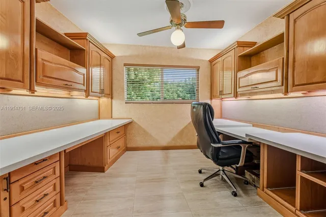 a spacious bathroom with a granite countertop sink a mirror a bathtub and shower