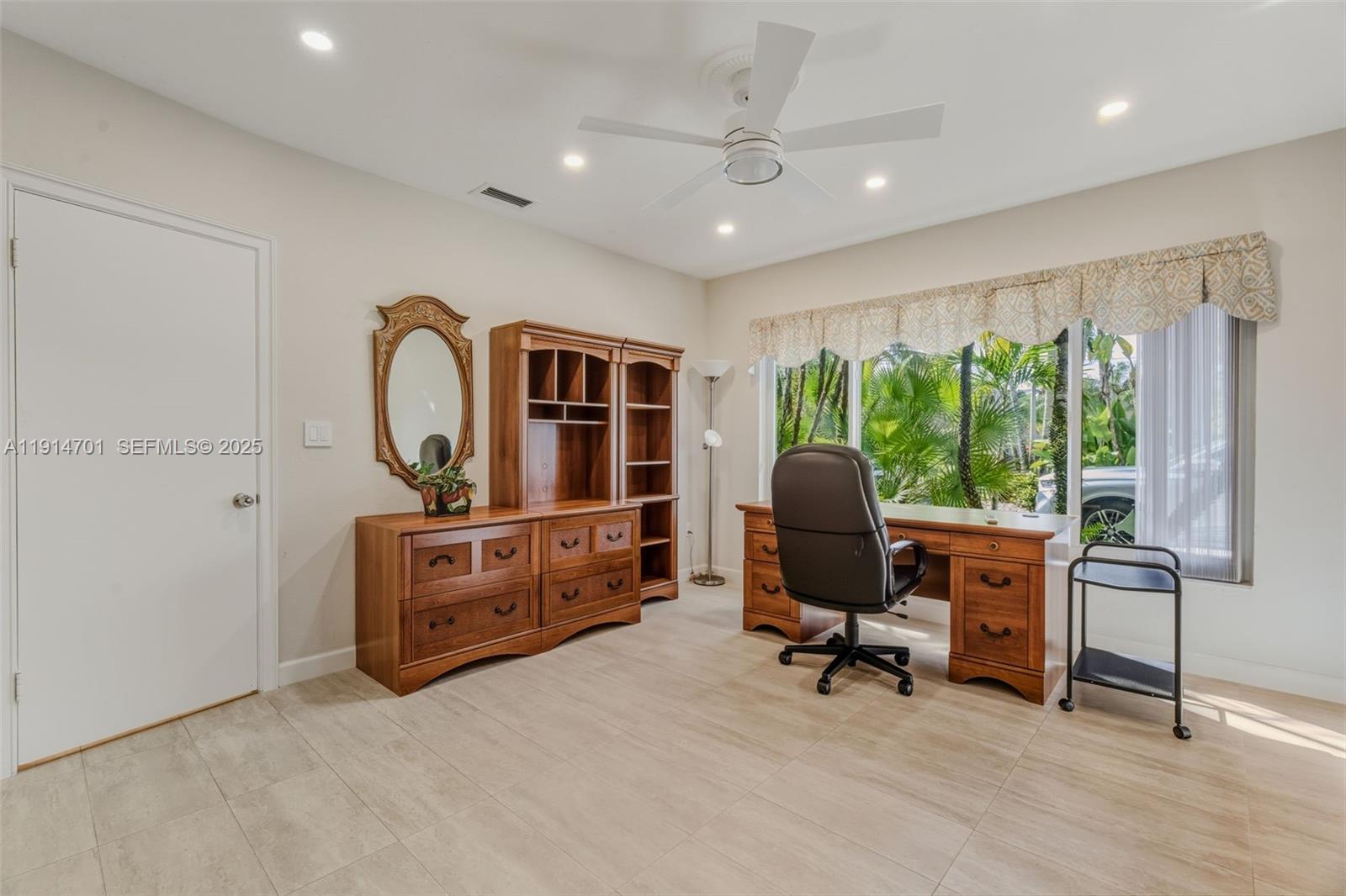 8001 Southwest 66th Terrace Miami, FL 33143 - Photo 23 of 35 a view of a livingroom with furniture window and a wooden floor