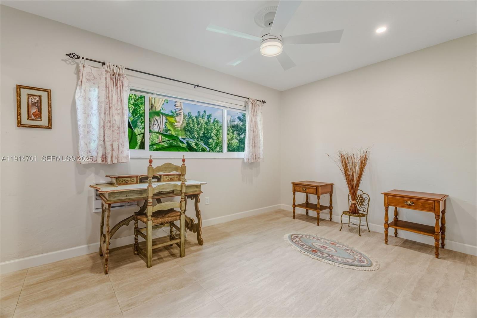 8001 Southwest 66th Terrace Miami, FL 33143 - Photo 25 of 35 a view of a workspace with furniture and a window