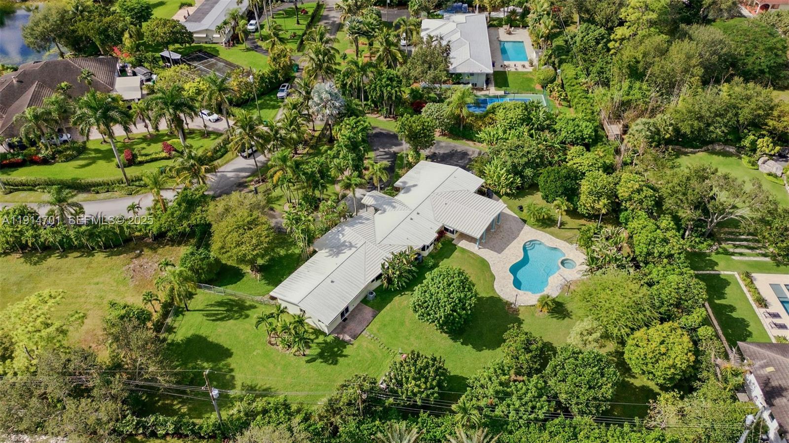 8001 Southwest 66th Terrace Miami, FL 33143 - Photo 34 of 35 an aerial view of residential house with outdoor space and trees all around