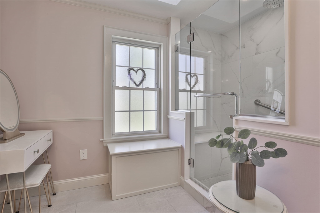 1106 Brook Road Milton, MA 02186 - Photo 11 of 25 a bathroom with a bathtub sink and mirror