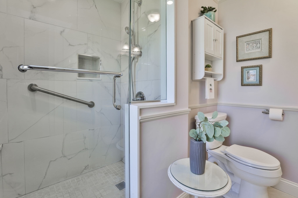 1106 Brook Road Milton, MA 02186 - Photo 12 of 25 a bathroom with a toilet and a shower