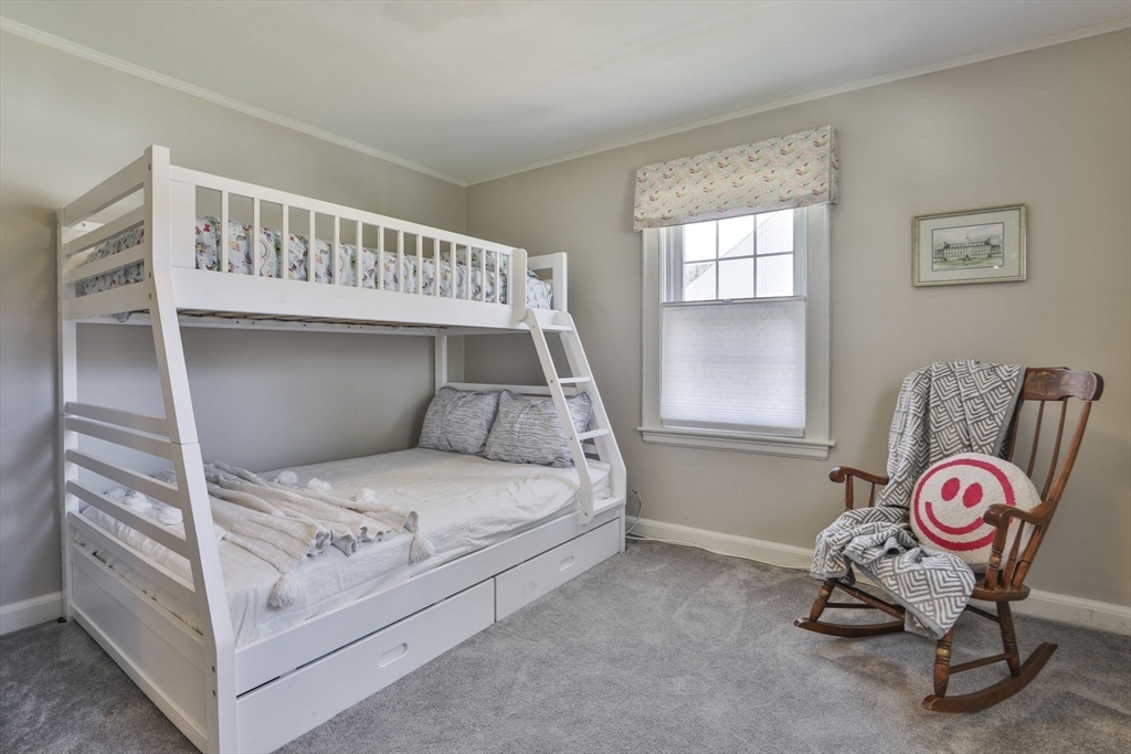 1106 Brook Road Milton, MA 02186 - Photo 17 of 25 a bedroom with a bed and window