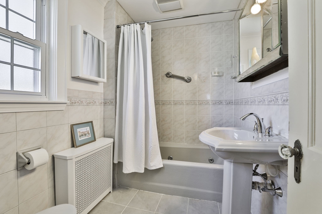 1106 Brook Road Milton, MA 02186 - Photo 18 of 25 a bathroom with a sink a toilet and shower