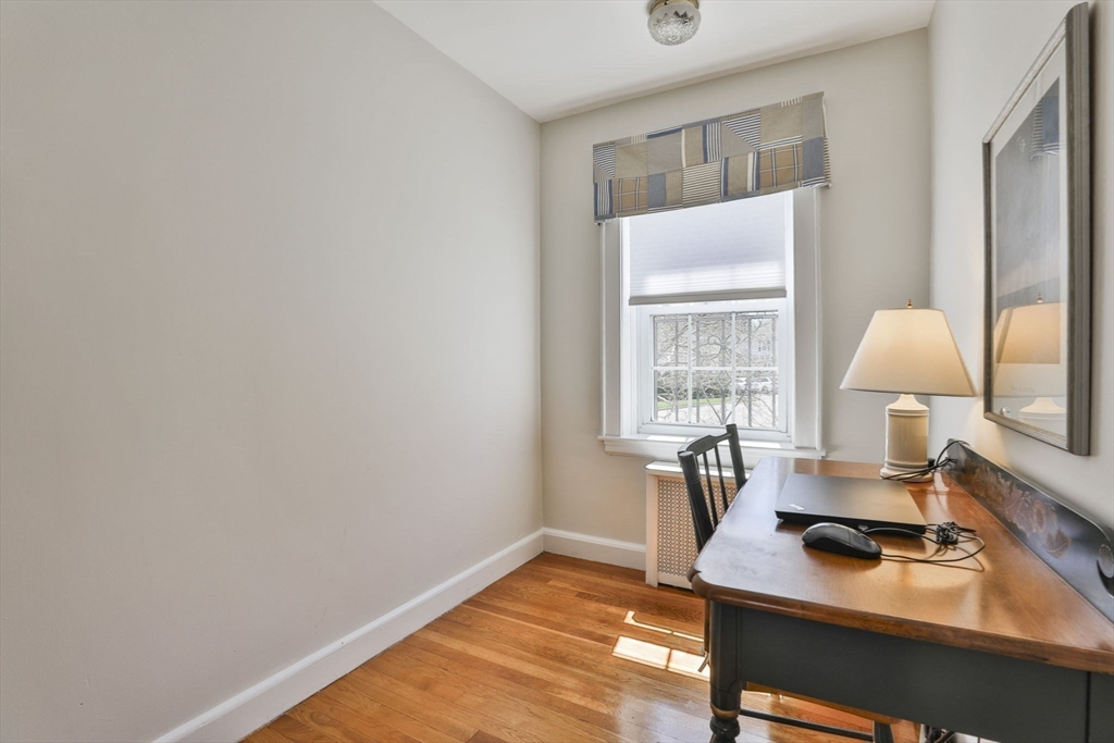 1106 Brook Road Milton, MA 02186 - Photo 19 of 25 a view of a workspace with furniture and a window