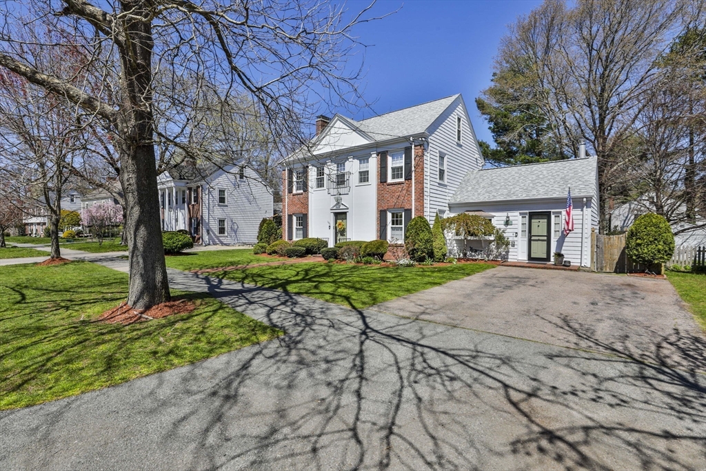 1106 Brook Road Milton, MA 02186 - Photo 2 of 25 a front view of a house with a yard