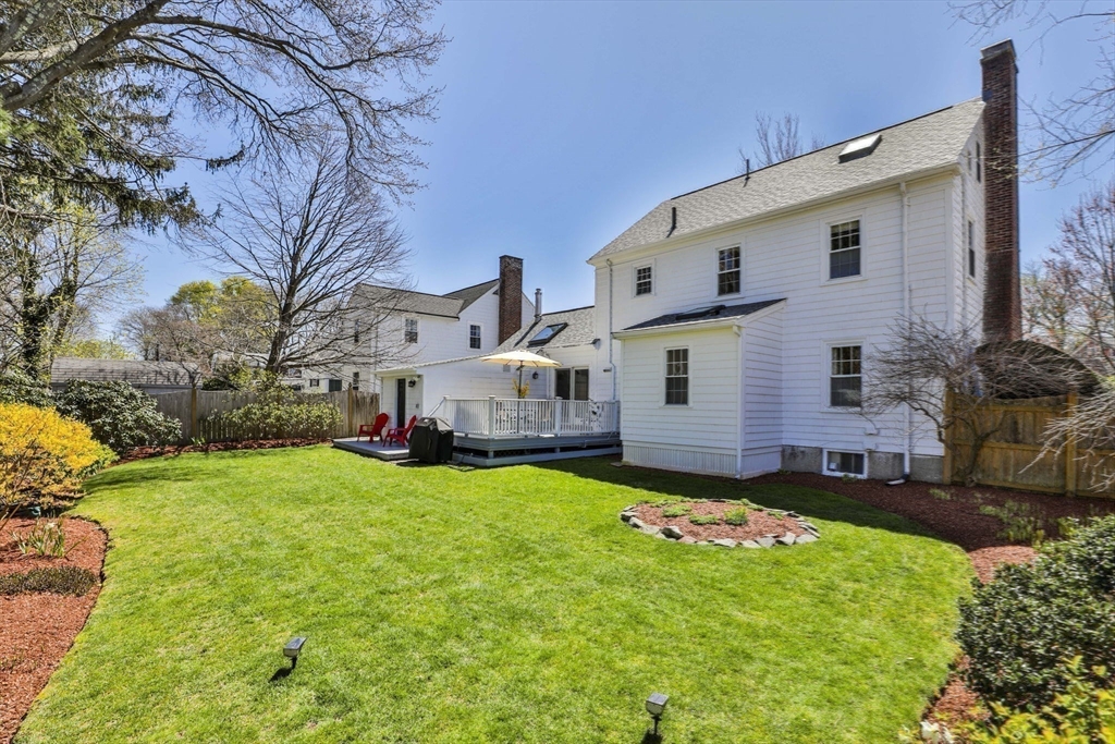 1106 Brook Road Milton, MA 02186 - Photo 25 of 25 a view of a house with a big yard potted plants and large tree