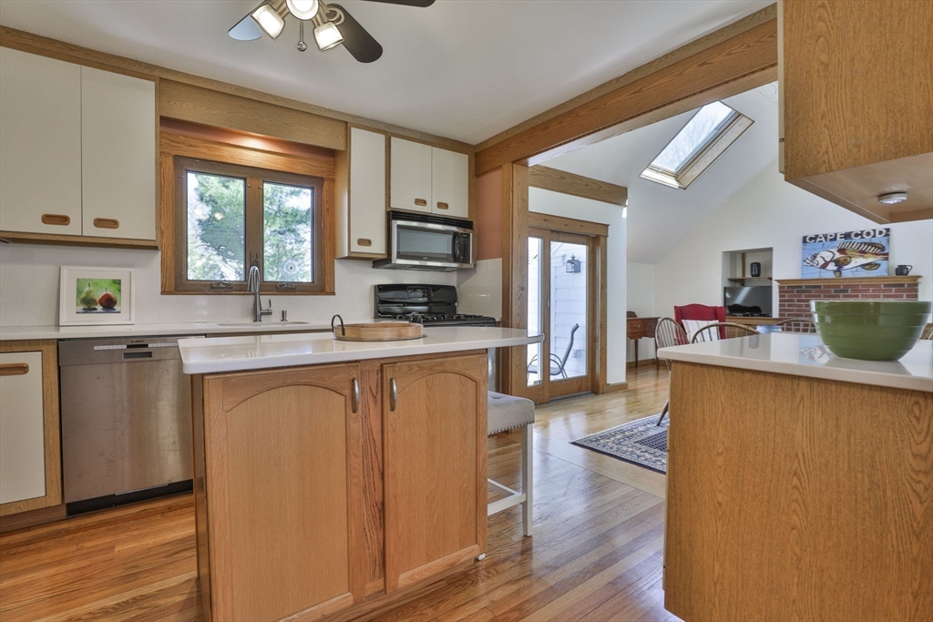 1106 Brook Road Milton, MA 02186 - Photo 6 of 25 a kitchen with granite countertop a refrigerator stove top oven and sink
