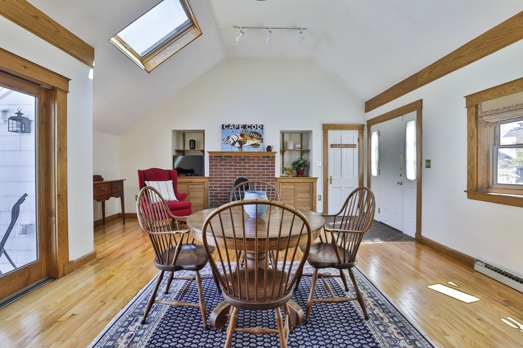 1106 Brook Road Milton, MA 02186 - Photo 8 of 25 a dining room with furniture a rug and wooden floor