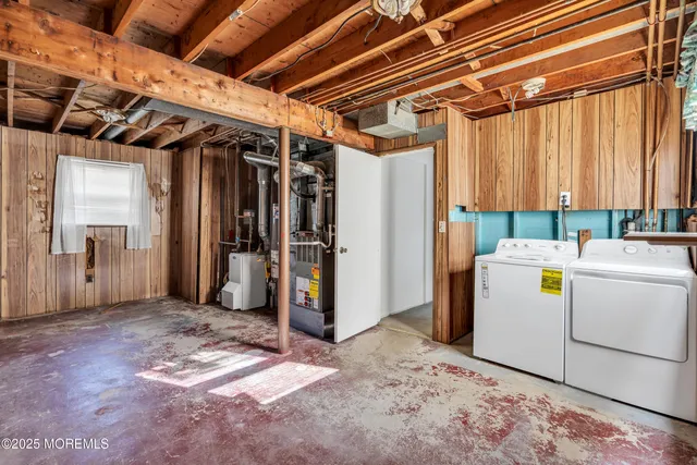 a view of storage and utility room with a washer and dryer