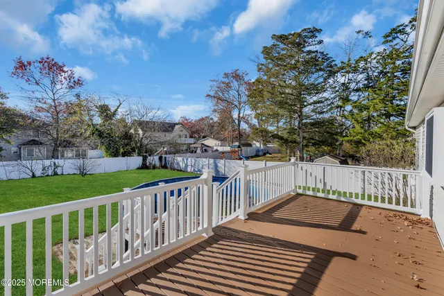 a view of a roof deck with wooden fence