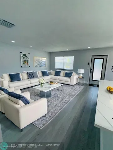 a living room with furniture and a couch