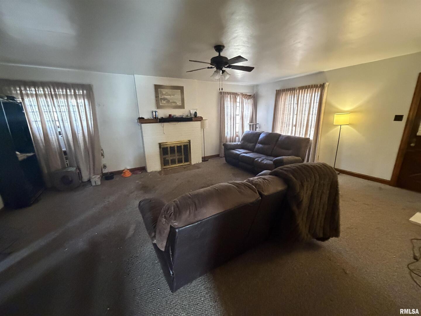 406 Cedar Street Centralia, IL 62801 - Photo 3 of 10 a spacious bedroom with a bed and a chandelier