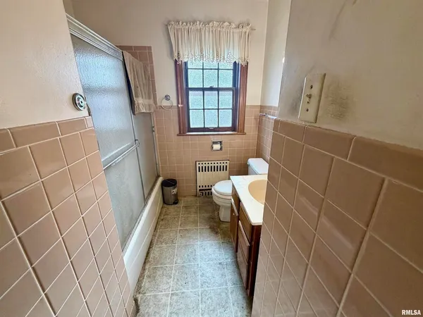 a bathroom with a sink and tub