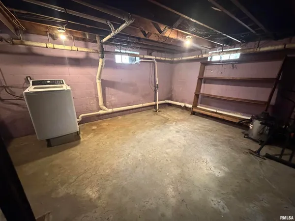 a view of an empty room with storage