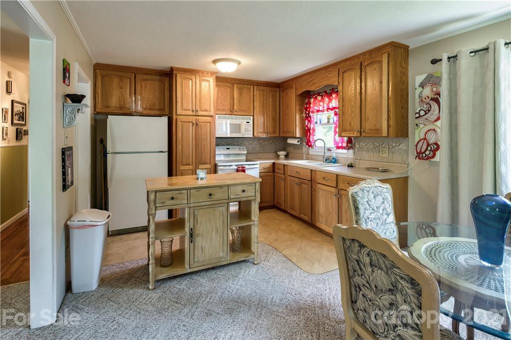 118 Eller Road Gastonia, NC 28056 - Photo 3 of 21 a kitchen with stainless steel appliances granite countertop a refrigerator sink and wooden cabinets