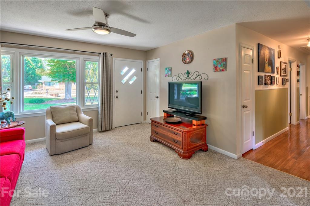118 Eller Road Gastonia, NC 28056 - Photo 8 of 21 a living room with furniture gym equipment and a large window