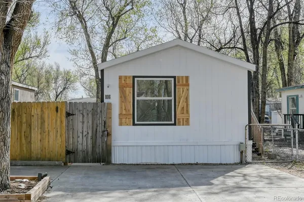 a house with a tree in front of it