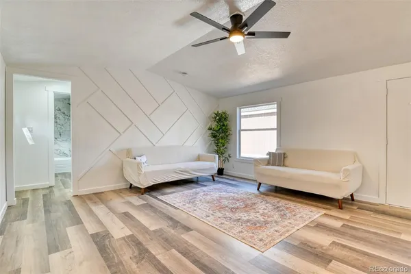 a living room with furniture and a rug