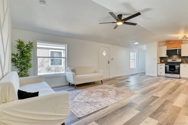 a living room with furniture and a window