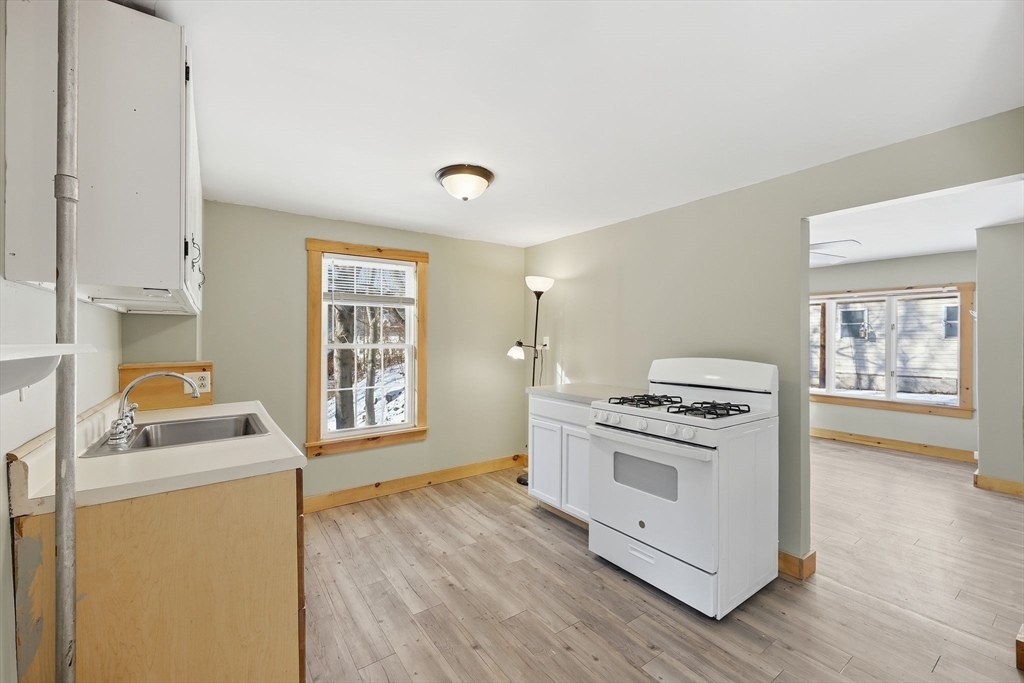 36 Sullivan Avenue Hardwick, MA 01031 - Photo 17 of 42 a kitchen with a stove a sink and a microwave