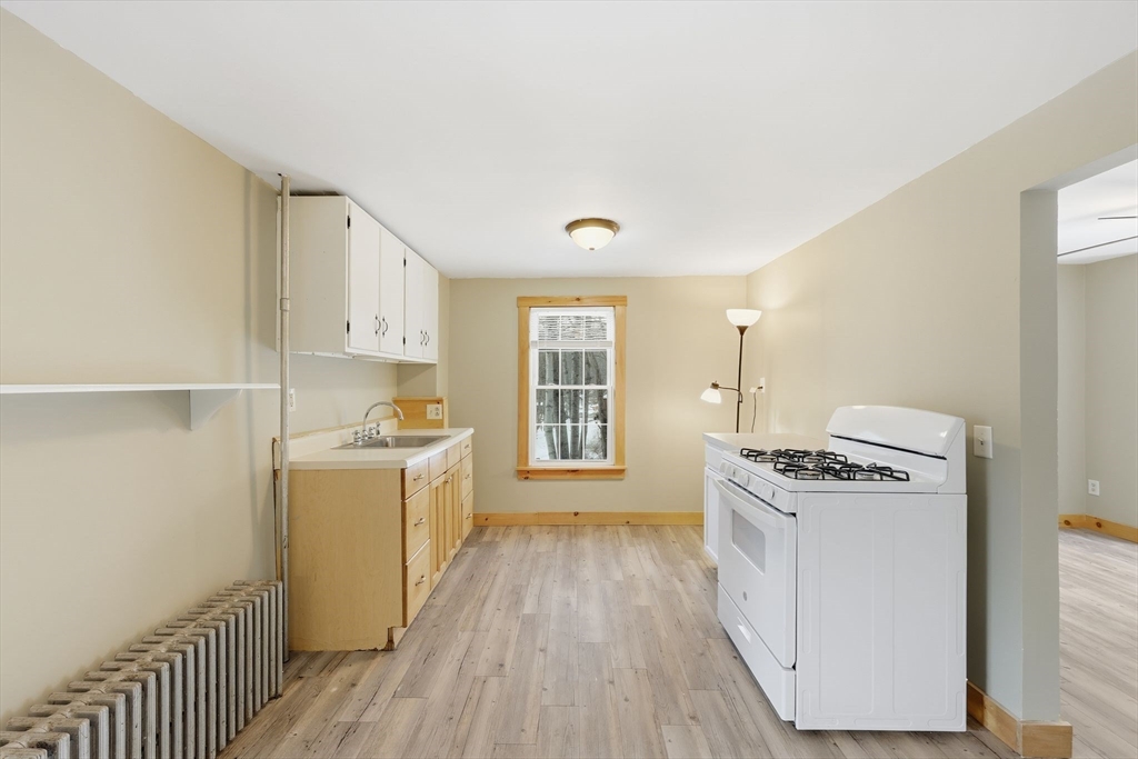 36 Sullivan Avenue Hardwick, MA 01031 - Photo 18 of 42 a kitchen with a stove a sink and a refrigerator