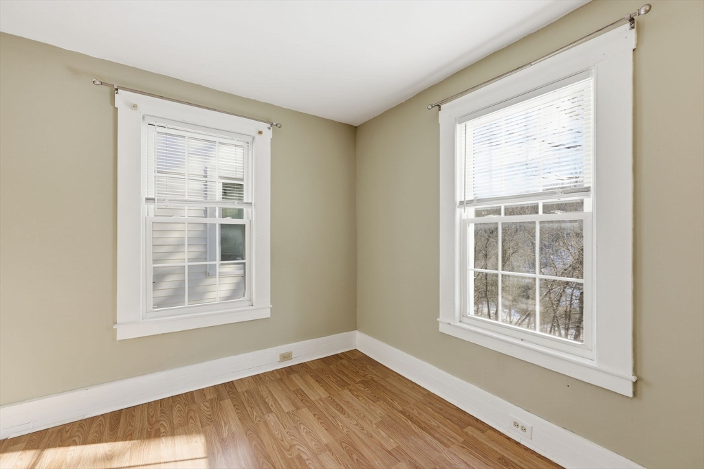 36 Sullivan Avenue Hardwick, MA 01031 - Photo 29 of 42 a view of an empty room with wooden floor and a window