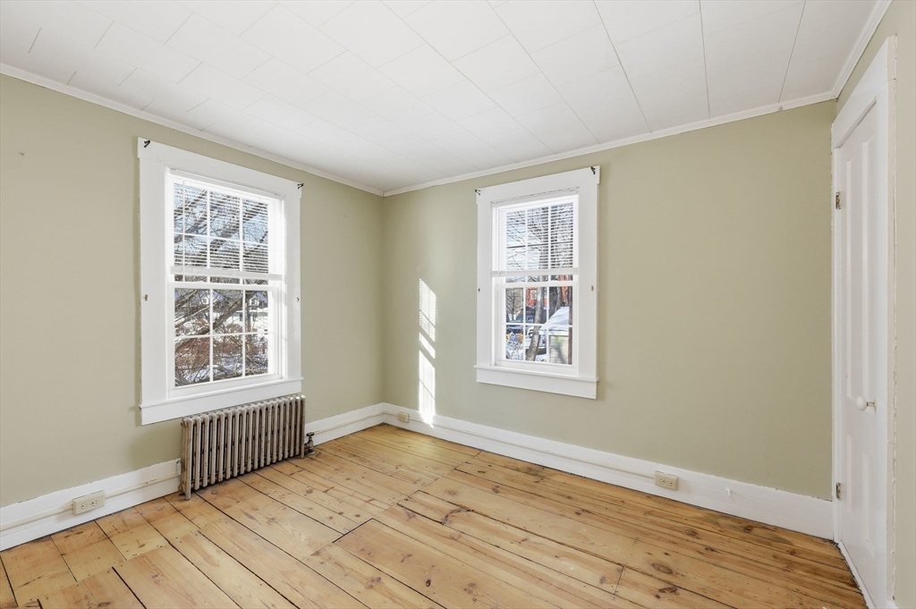 36 Sullivan Avenue Hardwick, MA 01031 - Photo 32 of 42 a view of an empty room with wooden floor and a window