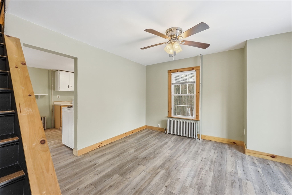 36 Sullivan Avenue Hardwick, MA 01031 - Photo 5 of 42 a view of empty room with wooden floor and fan