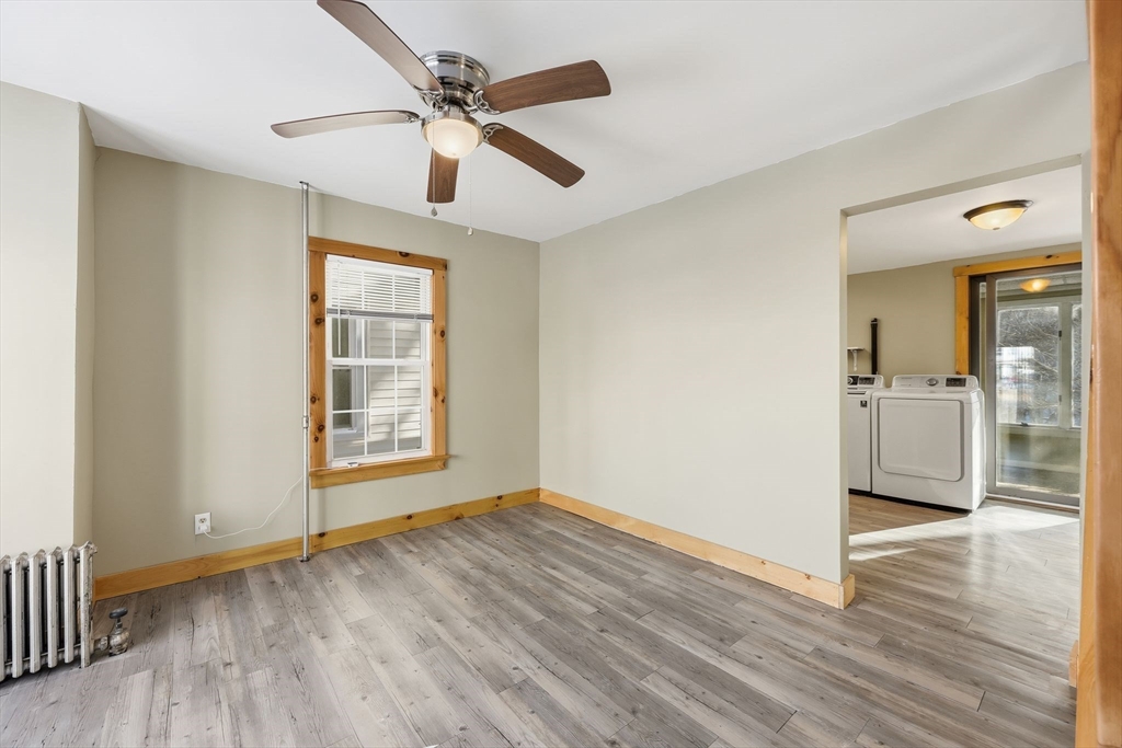 36 Sullivan Avenue Hardwick, MA 01031 - Photo 10 of 42 a view of an empty room with window and wooden floor