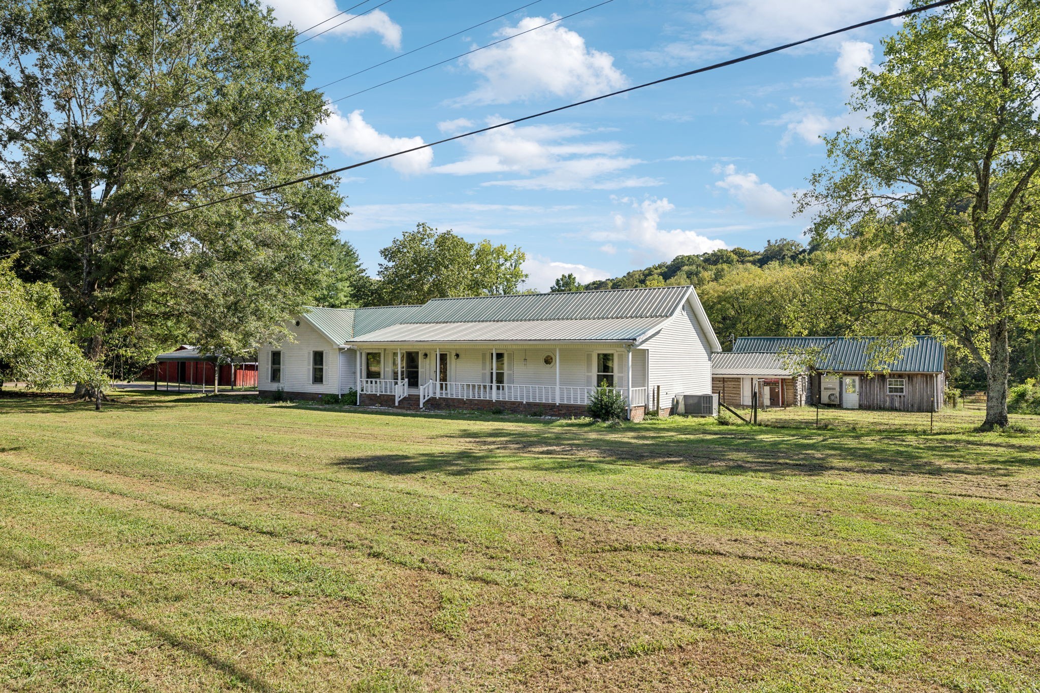 600 Blooming Grove Road Pulaski, TN 38478 - Photo 2 of 68 a front view of a house with a garden