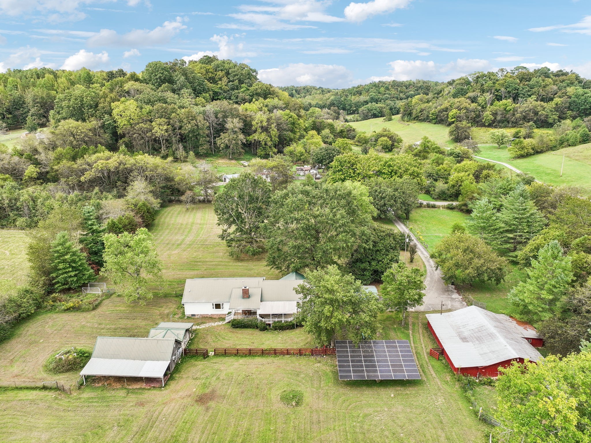600 Blooming Grove Road Pulaski, TN 38478 - Photo 42 of 68 an aerial view of a house with a yard basket ball court and outdoor seating