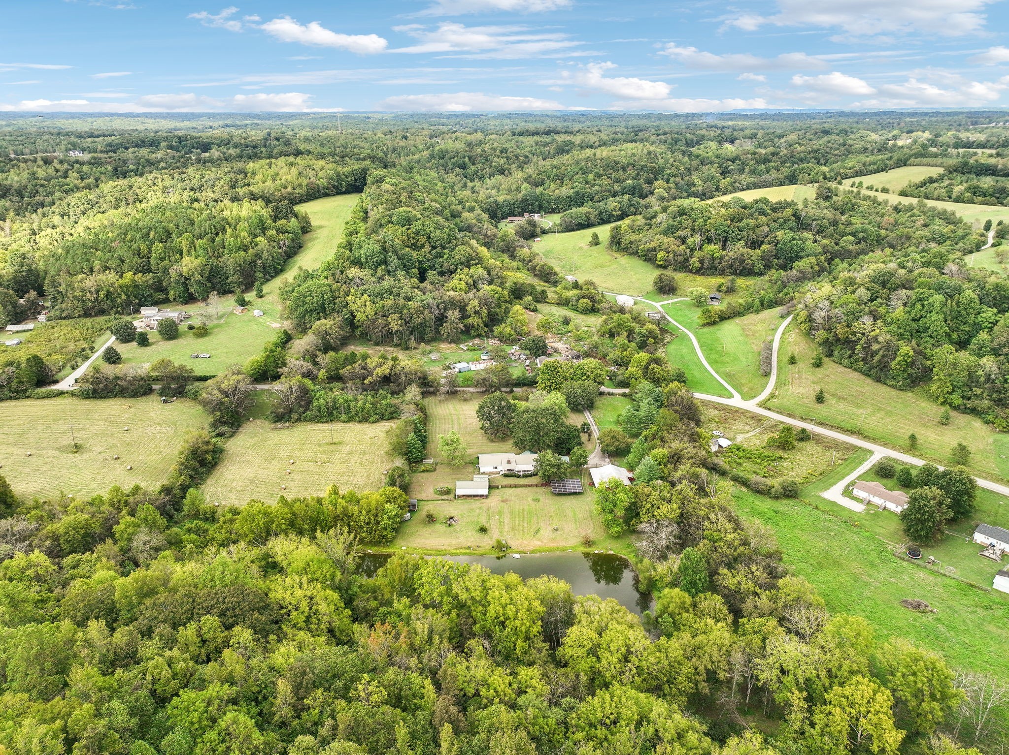 600 Blooming Grove Road Pulaski, TN 38478 - Photo 43 of 68 an aerial view of residential houses with outdoor space and trees