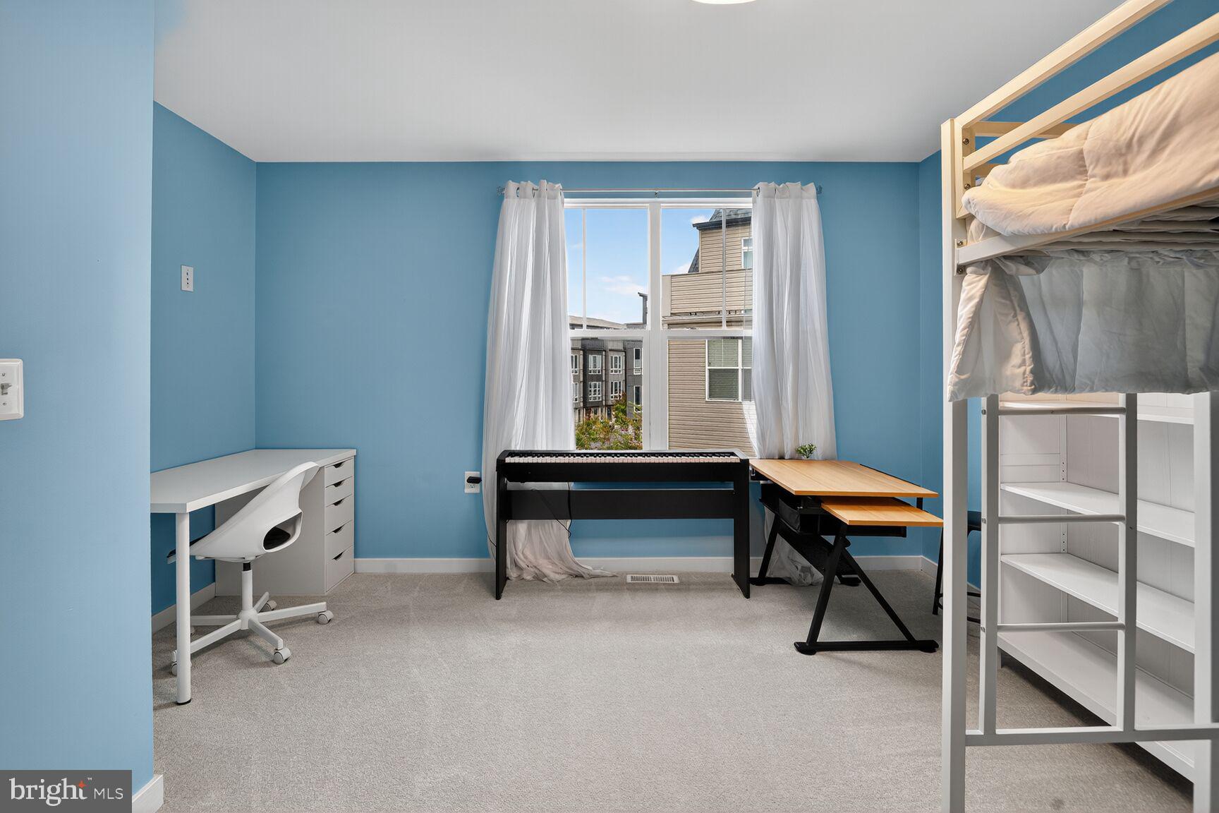 1449 Trafalgar Lane Frederick, MD 21701 - Photo 13 of 28 a room with furniture a rug and a window