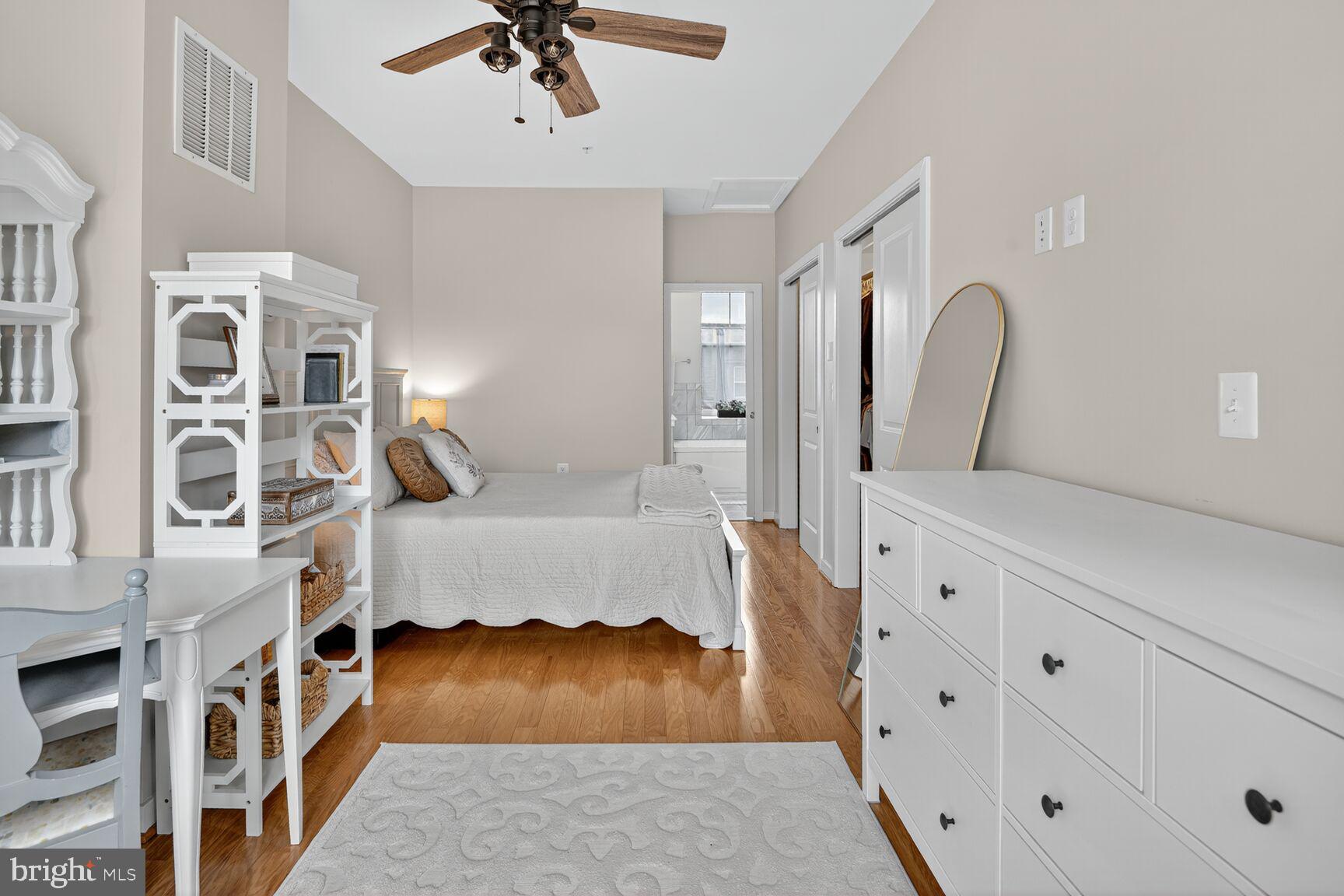 1449 Trafalgar Lane Frederick, MD 21701 - Photo 22 of 28 a bedroom with furniture and a wooden floor