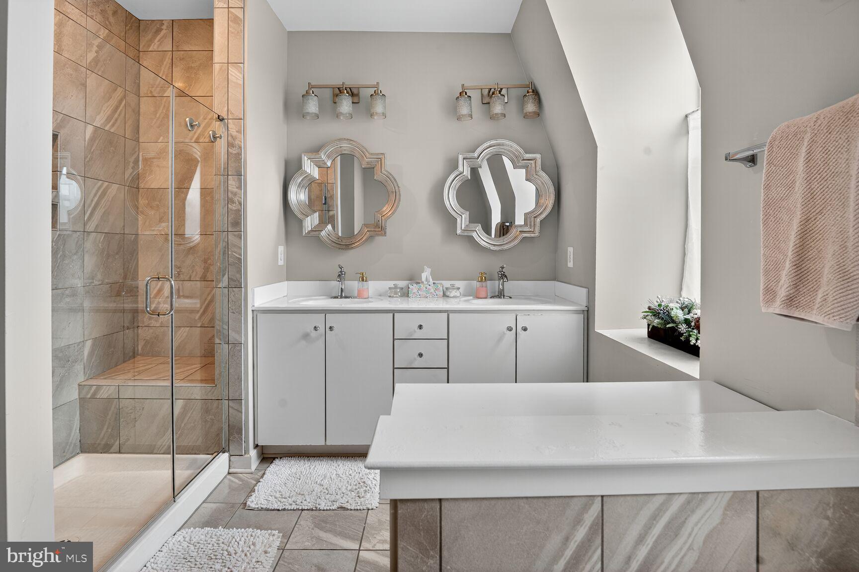 1449 Trafalgar Lane Frederick, MD 21701 - Photo 24 of 28 a bathroom with a sink and a mirror