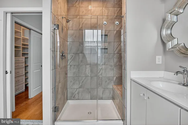 a spacious bathroom with a sink a toilet and shower curtain