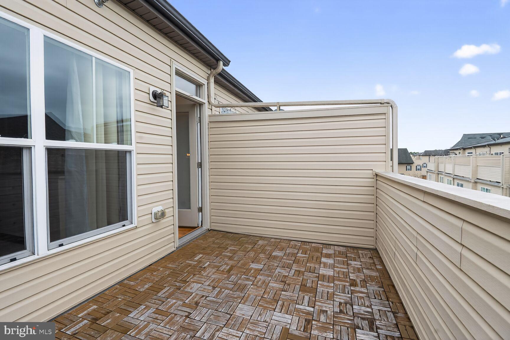 1449 Trafalgar Lane Frederick, MD 21701 - Photo 27 of 28 a view of a terrace with a white door