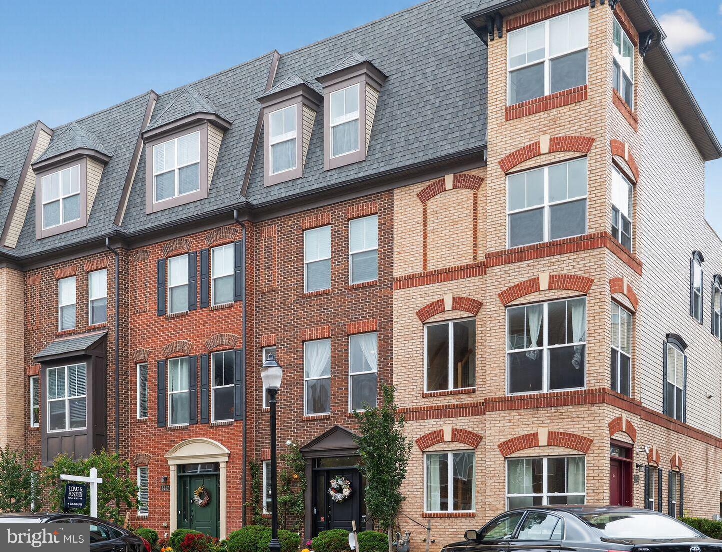 1449 Trafalgar Lane Frederick, MD 21701 - Photo 3 of 28 a large building with a lot of windows