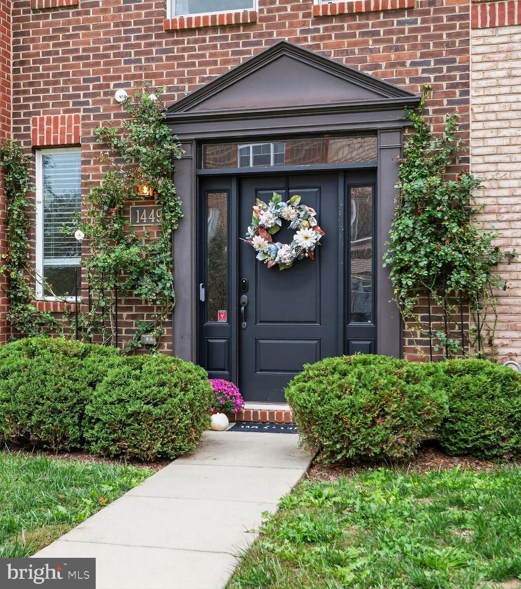 1449 Trafalgar Lane Frederick, MD 21701 - Photo 4 of 28 a front view of a house with garden