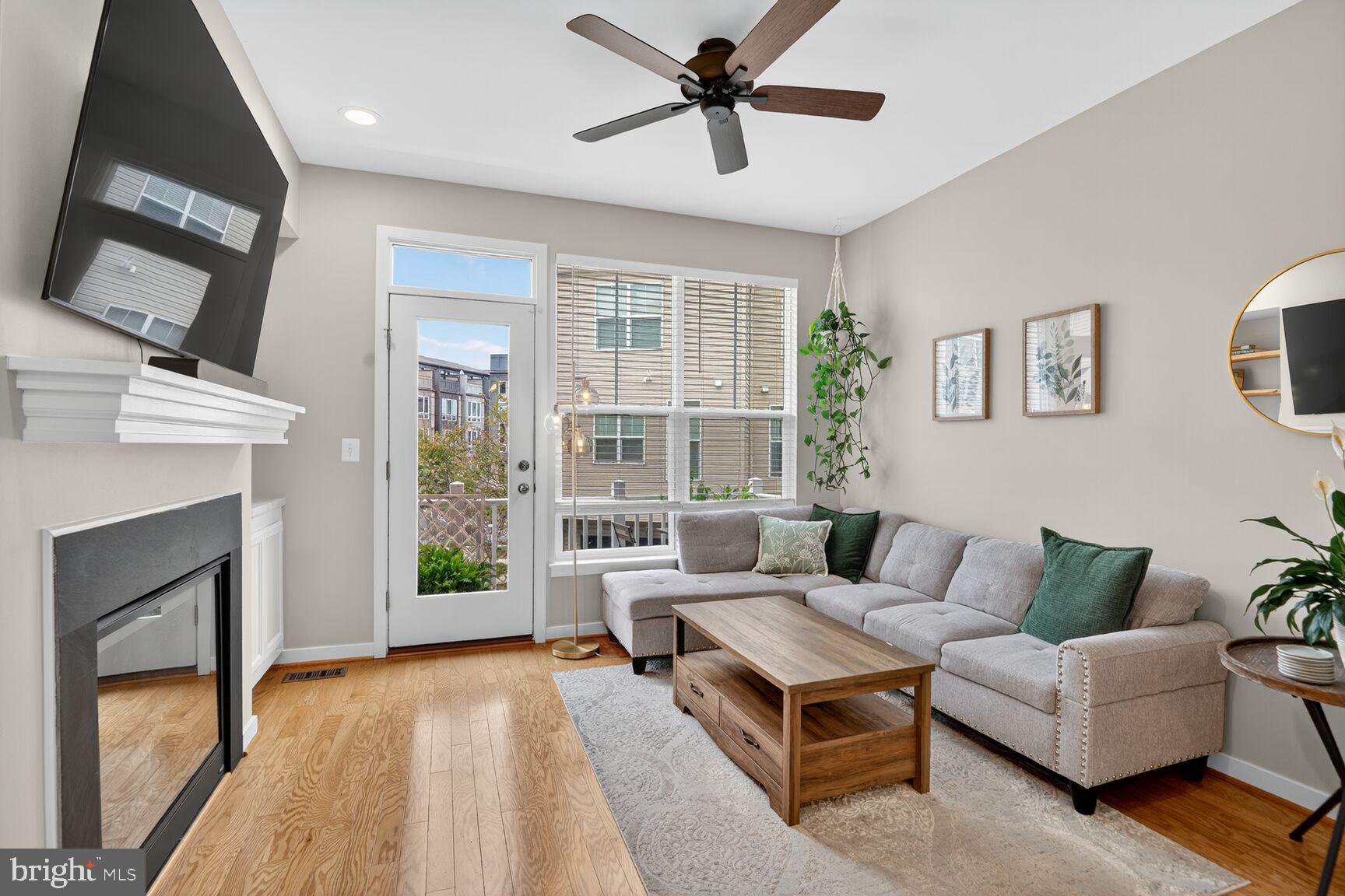 1449 Trafalgar Lane Frederick, MD 21701 - Photo 10 of 28 a living room with furniture and a fireplace