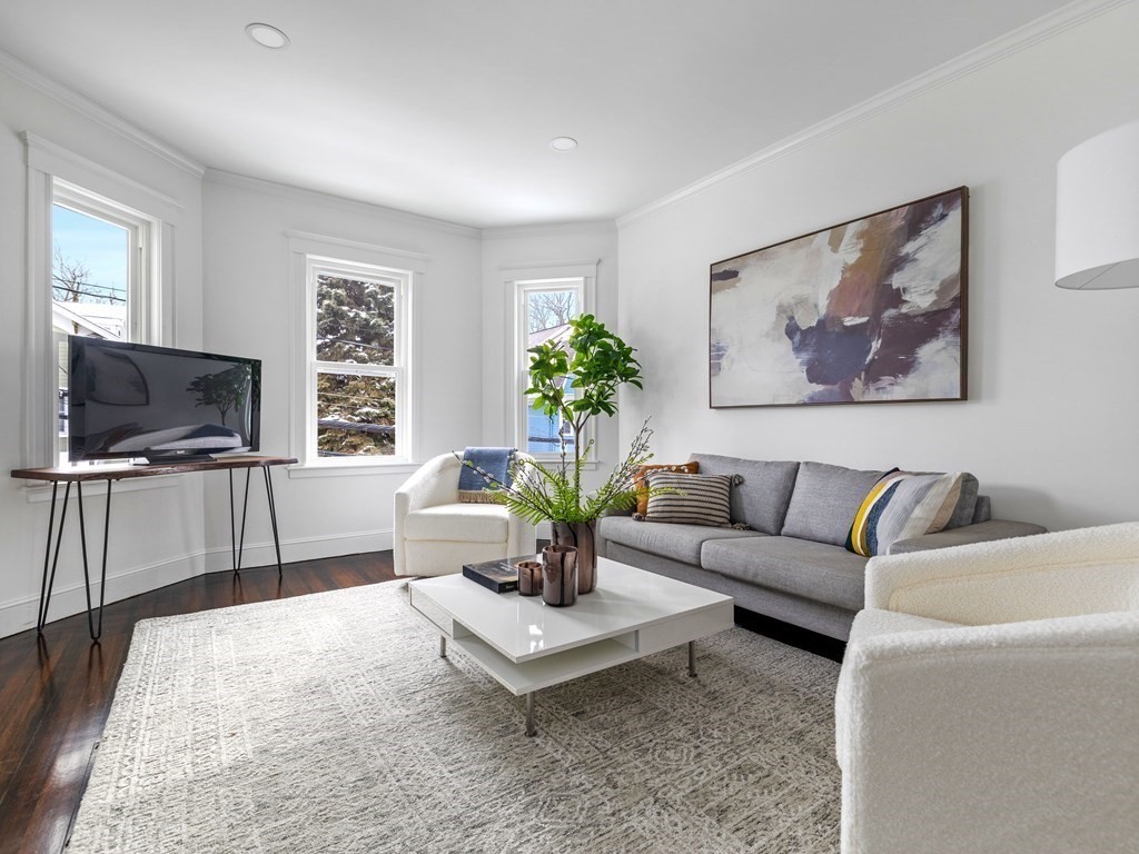 46 Sedgwick Street, Unit 2 Boston, MA 02130 - Photo 3 of 17 a living room with furniture and a flat screen tv