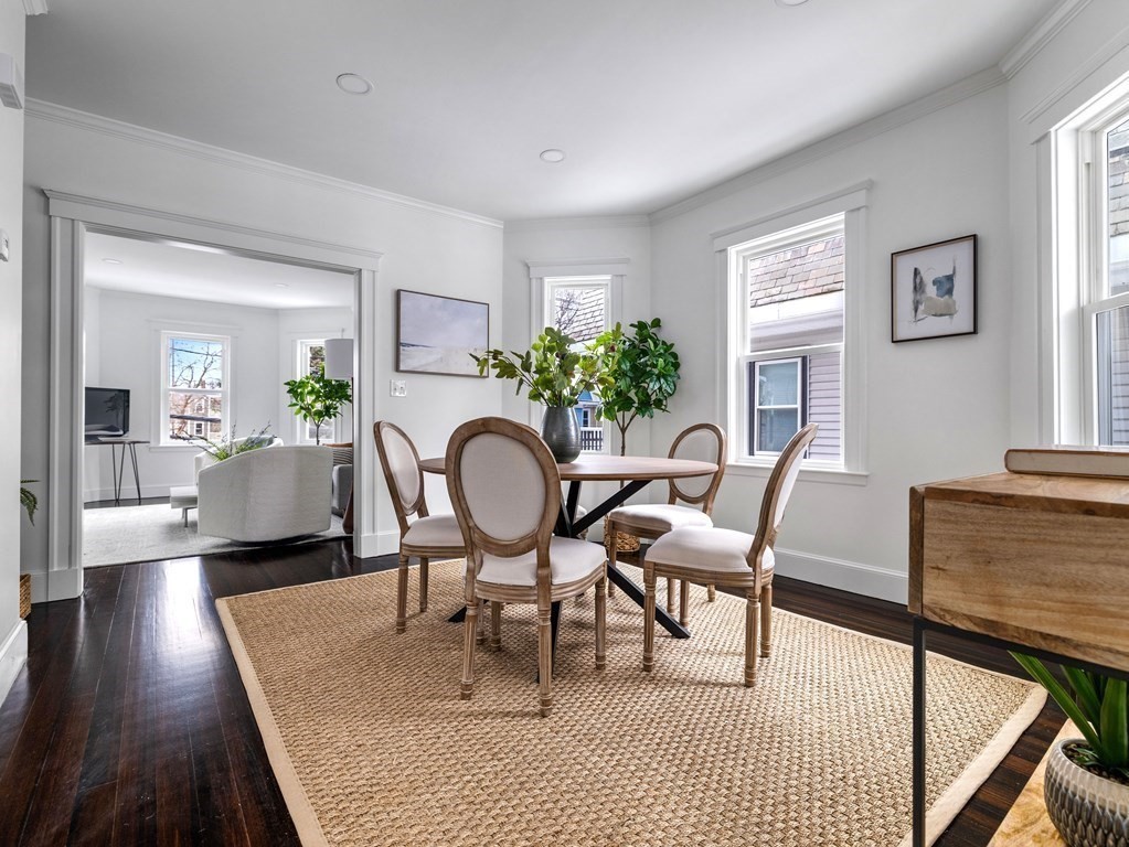 46 Sedgwick Street, Unit 2 Boston, MA 02130 - Photo 4 of 17 a view of a dining room with furniture a rug and wooden floor
