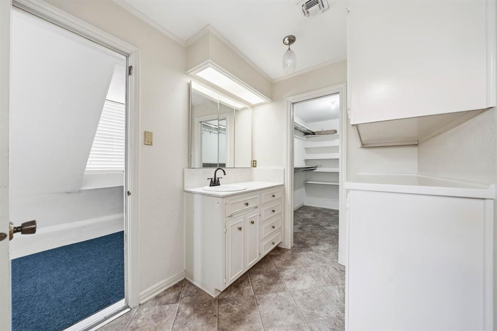 3400 Timbermill Road Waco, TX 76710 - Photo 15 of 35 a bathroom with a sink a mirror and a vanity