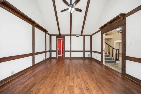 a view of an entryway with wooden floor